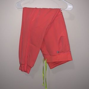 Figs joggers in HOT CORAL. Size medium